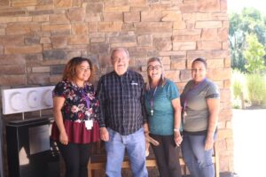 Two men talking on bench